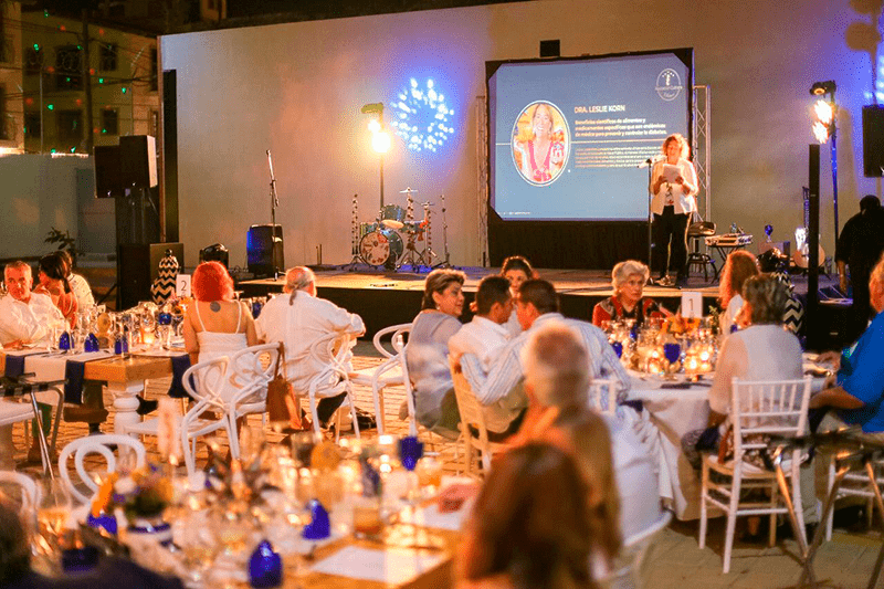 Wide shot of the event and Dr. Leslie Korn speaking