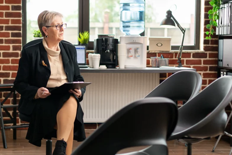 An integrative medicine and nutrition practitioner waiting in her office for a client