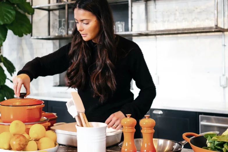 A young woman using food as medicine in her kitchen