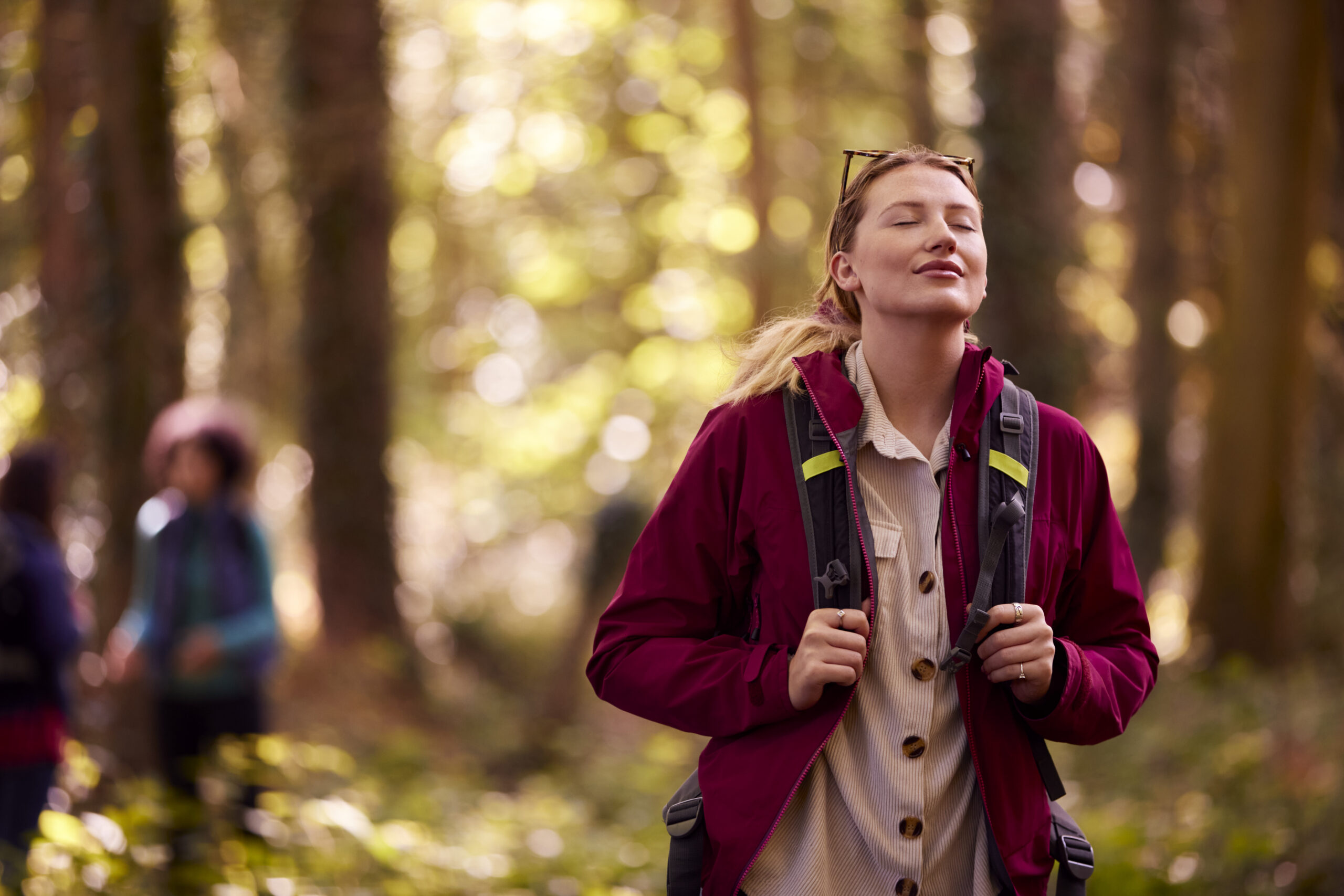 Young woman forest bathing for mental health