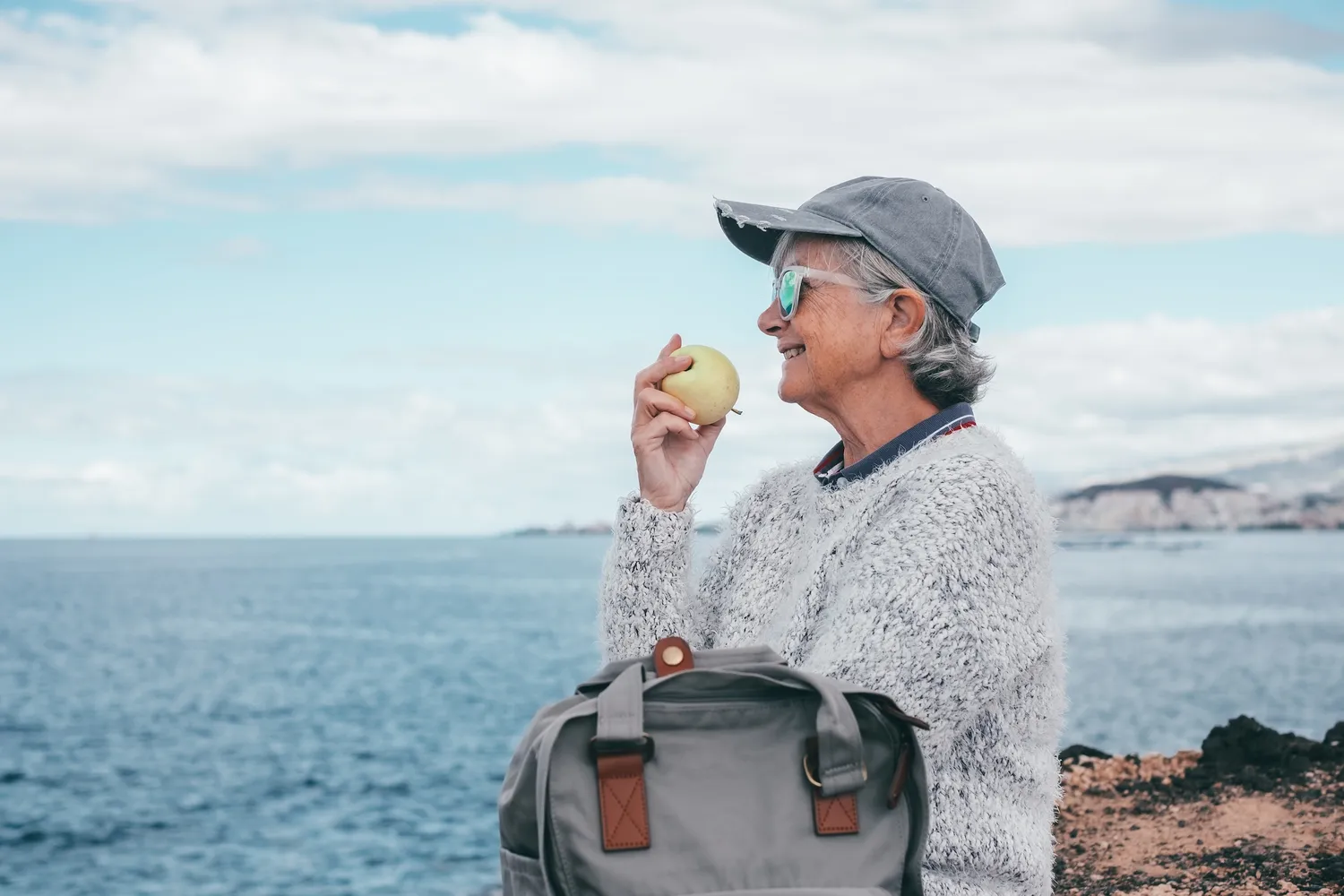 Default ALT text for smiling-elderly-woman-in-hat-and-sunglasses-sittin-2024-11-02-23-10-44-utc_result